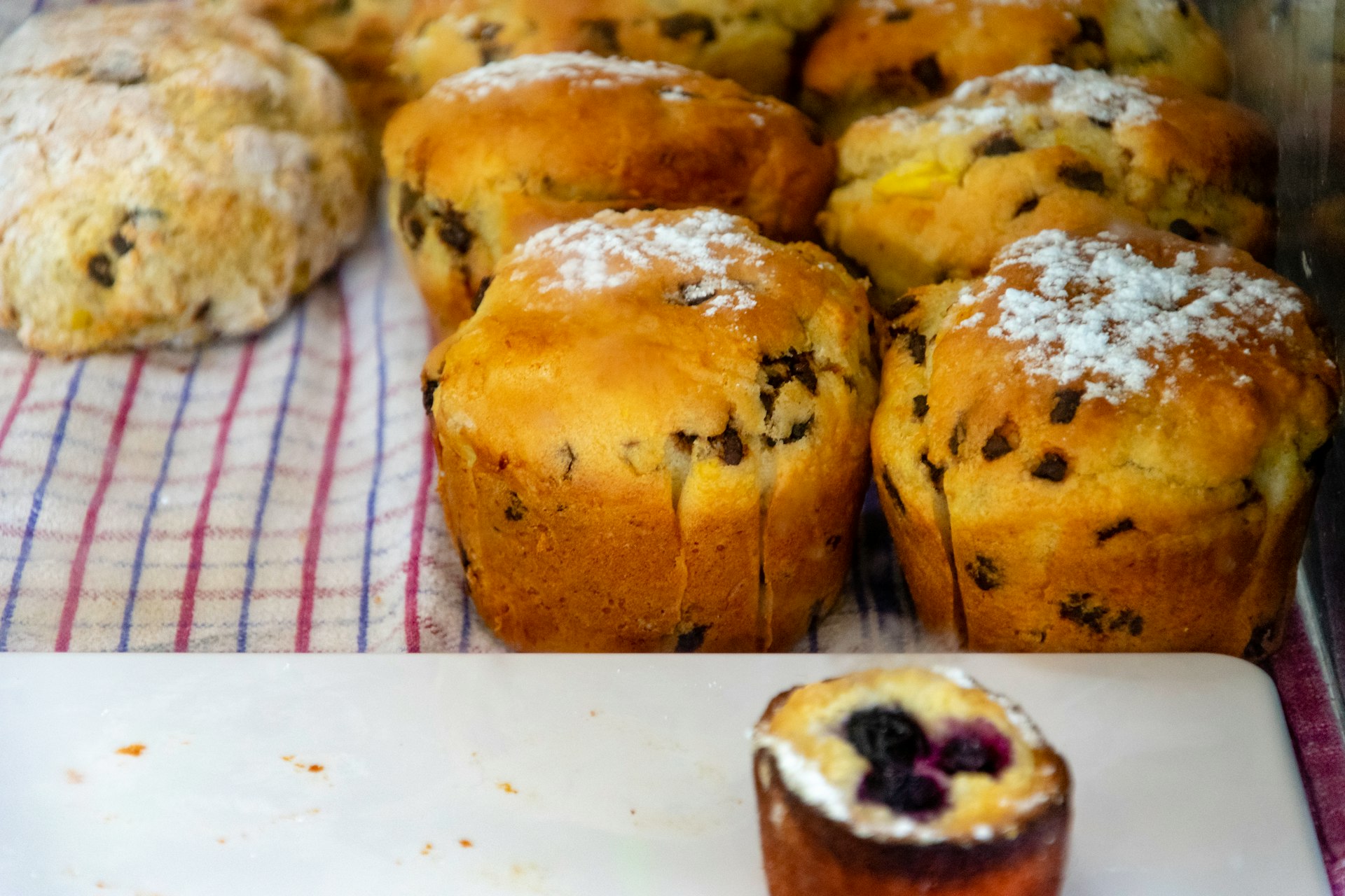 a bunch of muffins on the table
